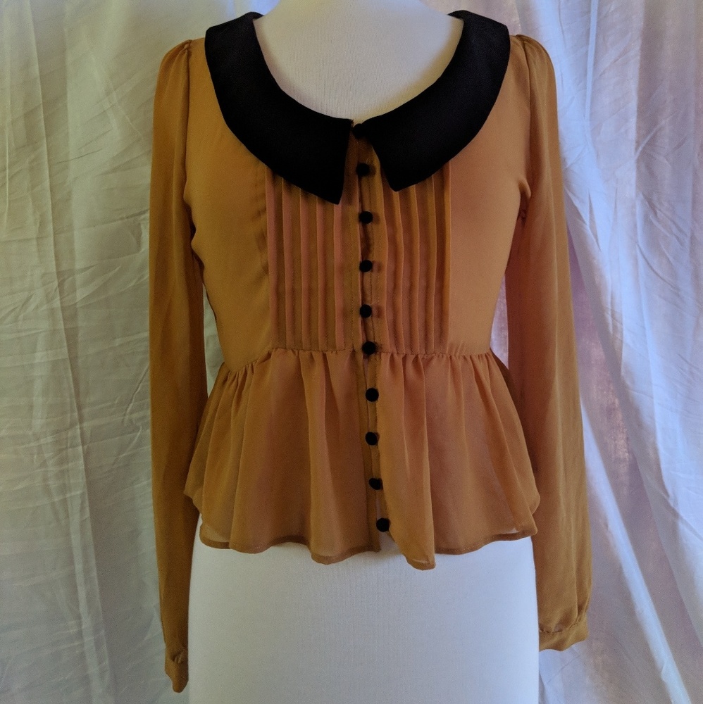 Yellow button down blouse.